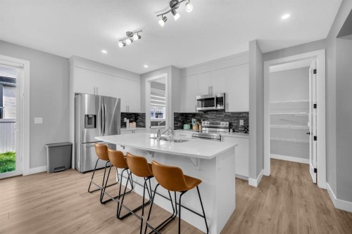 155 Carringham Way Nw, Calgary, AB - Indoor Photo Showing Kitchen With Upgraded Kitchen