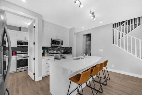 155 Carringham Way Nw, Calgary, AB - Indoor Photo Showing Kitchen With Double Sink With Upgraded Kitchen