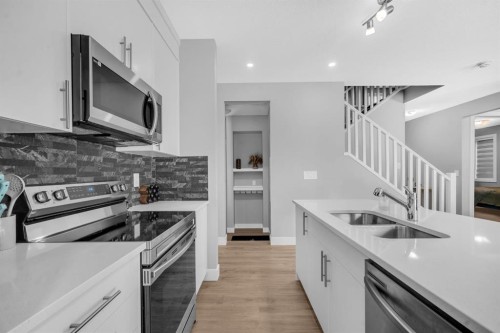 155 Carringham Way Nw, Calgary, AB - Indoor Photo Showing Kitchen With Double Sink With Upgraded Kitchen