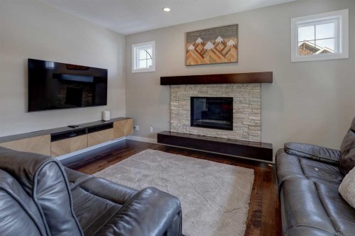 38 Cranbrook Place Se, Calgary, AB - Indoor Photo Showing Living Room With Fireplace