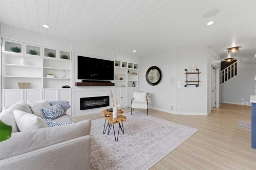 55 Marquis Green Se, Calgary, AB - Indoor Photo Showing Living Room With Fireplace