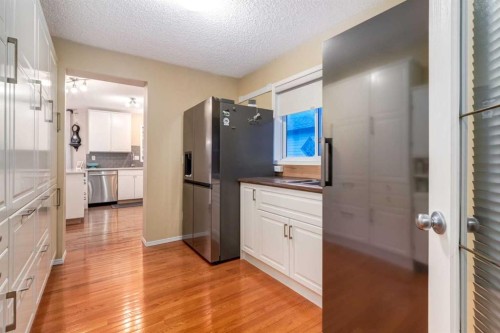27 Arbour Butte Road Nw, Calgary, AB - Indoor Photo Showing Kitchen