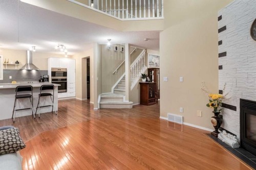27 Arbour Butte Road Nw, Calgary, AB - Indoor With Fireplace