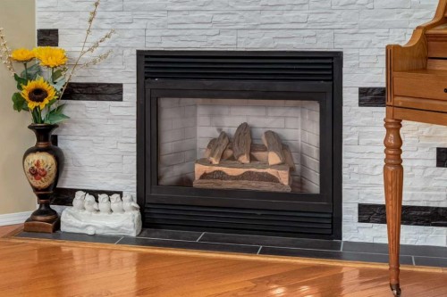 27 Arbour Butte Road Nw, Calgary, AB - Indoor Photo Showing Living Room With Fireplace