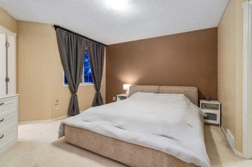 27 Arbour Butte Road Nw, Calgary, AB - Indoor Photo Showing Bedroom