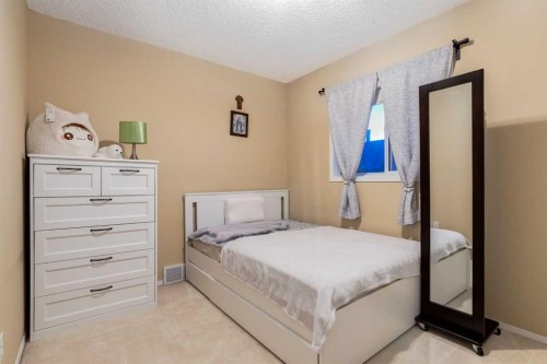 27 Arbour Butte Road Nw, Calgary, AB - Indoor Photo Showing Bedroom