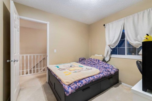 27 Arbour Butte Road Nw, Calgary, AB - Indoor Photo Showing Bedroom