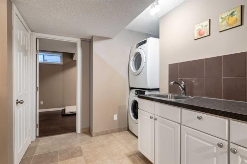 27 Arbour Butte Road Nw, Calgary, AB - Indoor Photo Showing Laundry Room