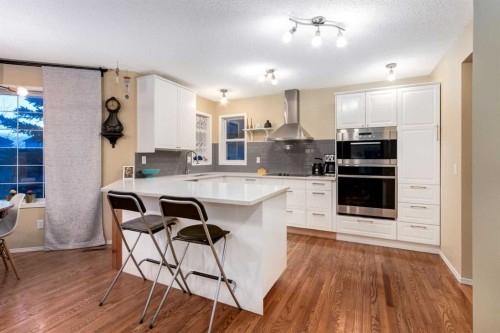 27 Arbour Butte Road Nw, Calgary, AB - Indoor Photo Showing Kitchen With Upgraded Kitchen