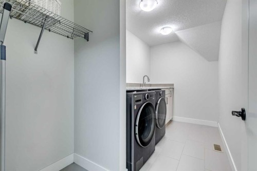 61 Masters Landing Se, Calgary, AB - Indoor Photo Showing Laundry Room