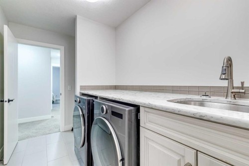 61 Masters Landing Se, Calgary, AB - Indoor Photo Showing Laundry Room