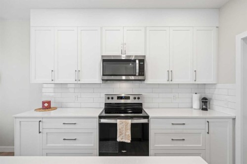 60 Ranchers View, Okotoks, AB - Indoor Photo Showing Kitchen With Upgraded Kitchen