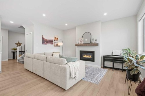 60 Ranchers View, Okotoks, AB - Indoor Photo Showing Living Room With Fireplace