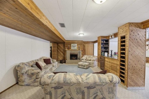 5350 57 Avenue, Olds, AB - Indoor Photo Showing Living Room With Fireplace
