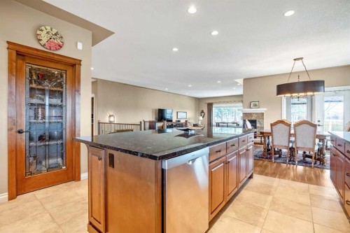 341 1 Avenue Se, Diamond Valley, AB - Indoor Photo Showing Dining Room With Fireplace