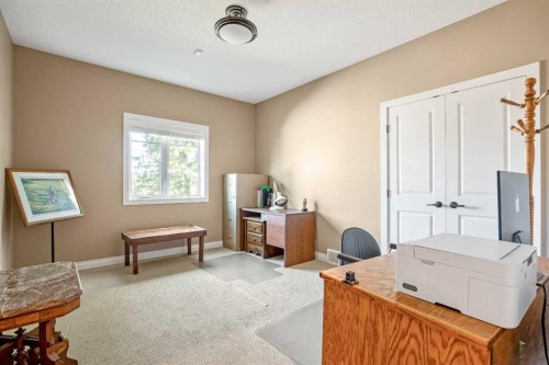 341 1 Avenue Se, Diamond Valley, AB - Indoor Photo Showing Bedroom