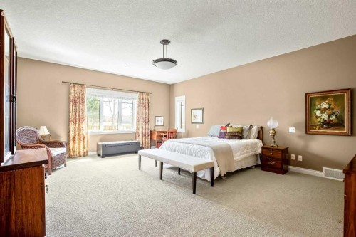 341 1 Avenue Se, Diamond Valley, AB - Indoor Photo Showing Bedroom