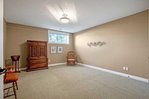 341 1 Avenue Se, Diamond Valley, AB - Indoor Photo Showing Bedroom