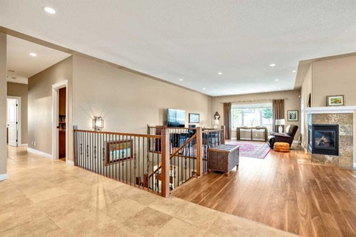 341 1 Avenue Se, Diamond Valley, AB - Indoor Photo Showing Living Room With Fireplace