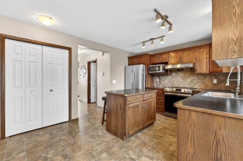 57 Everridge Way Sw, Calgary, AB - Indoor Photo Showing Kitchen With Stainless Steel Kitchen