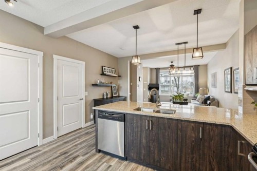 166 Legacy Common Se, Calgary, AB - Indoor Photo Showing Kitchen With Double Sink With Upgraded Kitchen