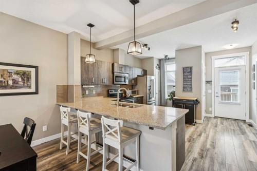166 Legacy Common Se, Calgary, AB - Indoor Photo Showing Kitchen With Double Sink With Upgraded Kitchen