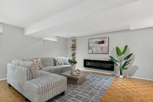 425 Woodland Crescent Se, Calgary, AB - Indoor Photo Showing Living Room With Fireplace