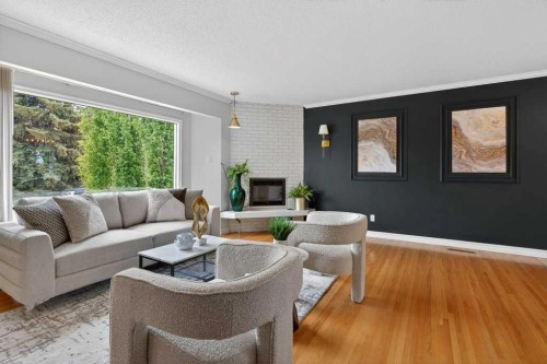 425 Woodland Crescent Se, Calgary, AB - Indoor Photo Showing Living Room With Fireplace