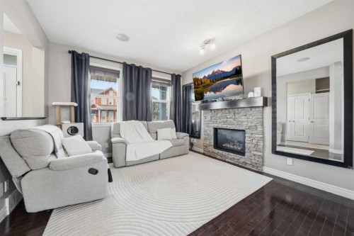 67 Evanspark Road Nw, Calgary, AB - Indoor Photo Showing Living Room With Fireplace