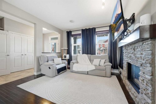 67 Evanspark Road Nw, Calgary, AB - Indoor Photo Showing Living Room With Fireplace