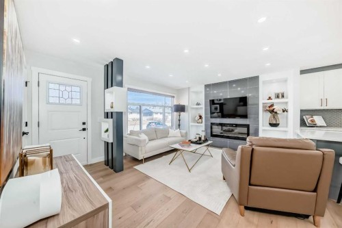 9215 Allison Drive Se, Calgary, AB - Indoor Photo Showing Living Room With Fireplace