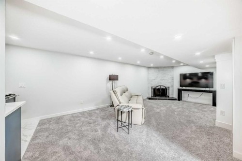 9215 Allison Drive Se, Calgary, AB - Indoor With Fireplace