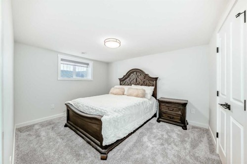 9215 Allison Drive Se, Calgary, AB - Indoor Photo Showing Bedroom