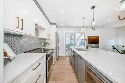 9215 Allison Drive Se, Calgary, AB - Indoor Photo Showing Kitchen With Double Sink With Upgraded Kitchen