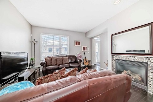 188 Chapalina Square Se, Calgary, AB - Indoor Photo Showing Living Room With Fireplace