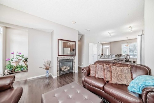 188 Chapalina Square Se, Calgary, AB - Indoor Photo Showing Living Room With Fireplace