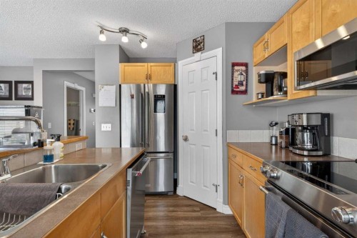 194 Arbour Meadows Close Nw, Calgary, AB - Indoor Photo Showing Kitchen With Stainless Steel Kitchen With Double Sink