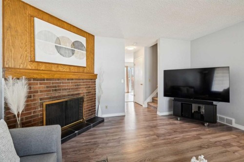 6503 Rundlehorn Drive Ne, Calgary, AB - Indoor Photo Showing Living Room With Fireplace