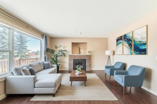 273 Silverado Plains Close Sw, Calgary, AB - Indoor Photo Showing Living Room With Fireplace