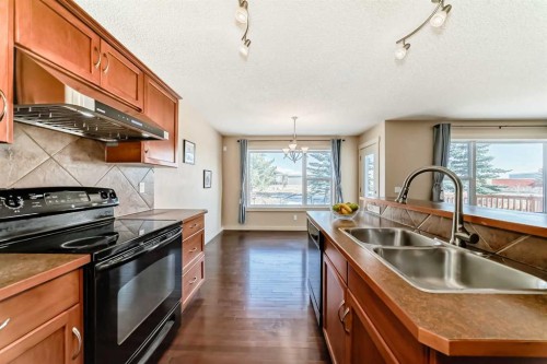 273 Silverado Plains Close Sw, Calgary, AB - Indoor Photo Showing Kitchen With Double Sink
