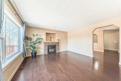 273 Silverado Plains Close Sw, Calgary, AB - Indoor Photo Showing Living Room With Fireplace