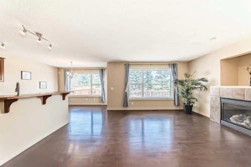273 Silverado Plains Close Sw, Calgary, AB - Indoor Photo Showing Other Room With Fireplace