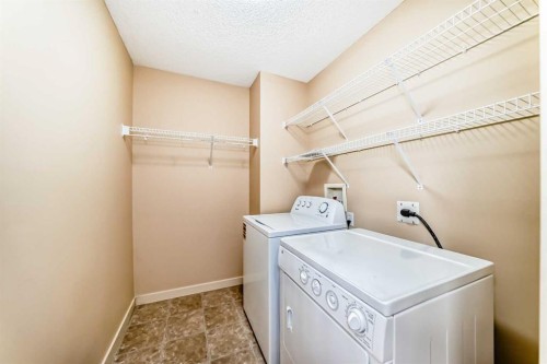 273 Silverado Plains Close Sw, Calgary, AB - Indoor Photo Showing Laundry Room