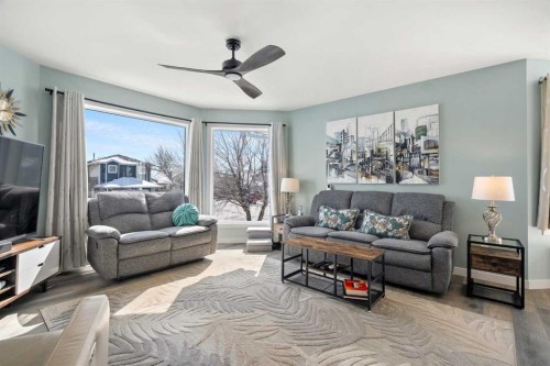 276 Riverside Mews Se, Calgary, AB - Indoor Photo Showing Living Room