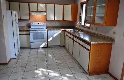 319 Woodside Circle Sw, Calgary, AB - Indoor Photo Showing Kitchen With Double Sink