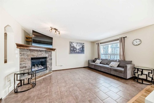 7 Tuscany Ridge Crescent Nw, Calgary, AB - Indoor Photo Showing Living Room With Fireplace