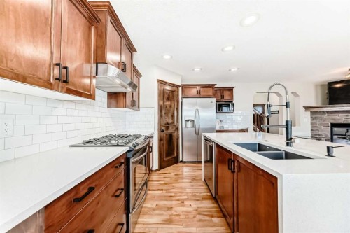 7 Tuscany Ridge Crescent Nw, Calgary, AB - Indoor Photo Showing Kitchen With Double Sink With Upgraded Kitchen