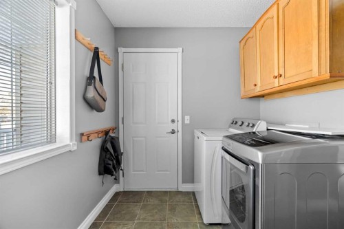 27 Henderson Road Ne, Langdon, AB - Indoor Photo Showing Laundry Room