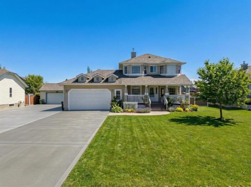 27 Henderson Road Ne, Langdon, AB - Outdoor With Deck Patio Veranda With Facade