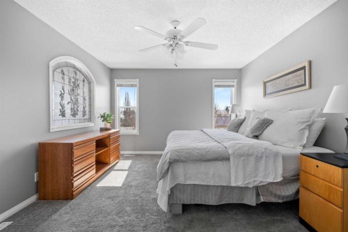 27 Henderson Road Ne, Langdon, AB - Indoor Photo Showing Bedroom
